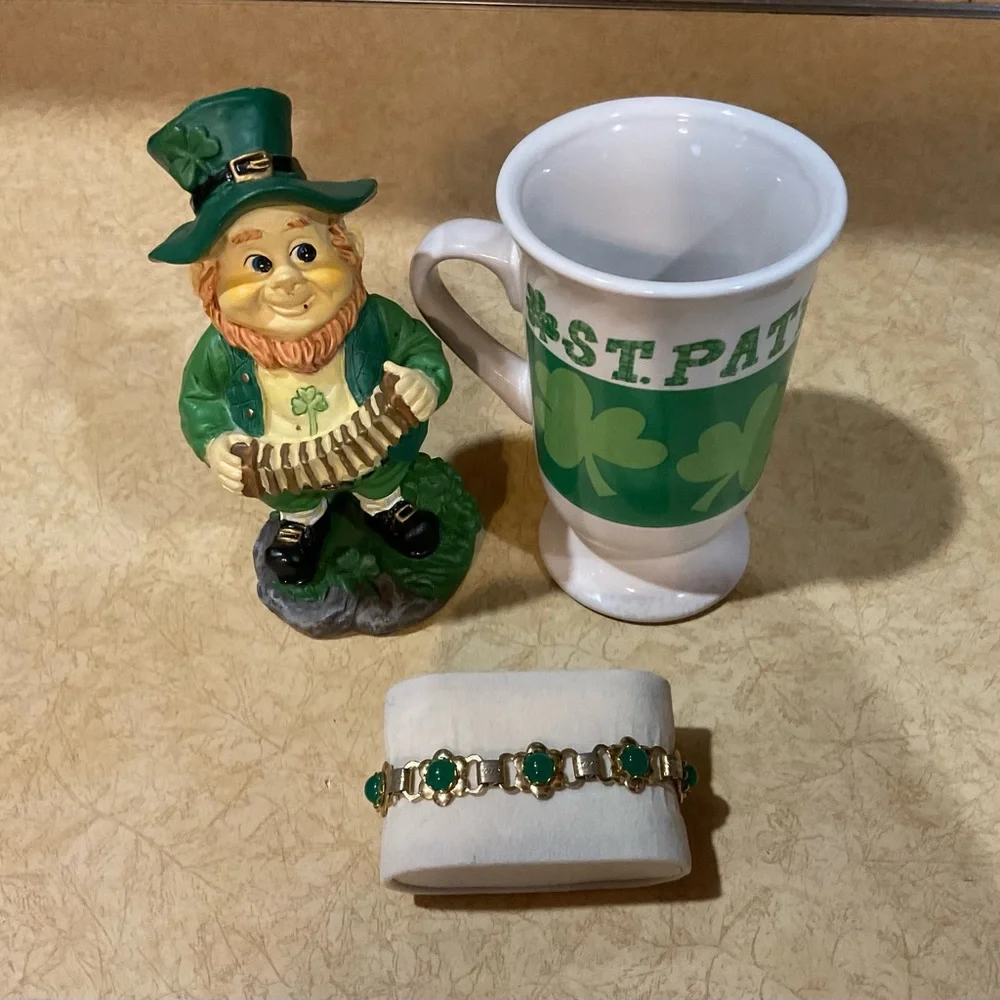 St. Patrick’s Day: mug, leprechaun, ngold plated/tone bracelet with green stone.
